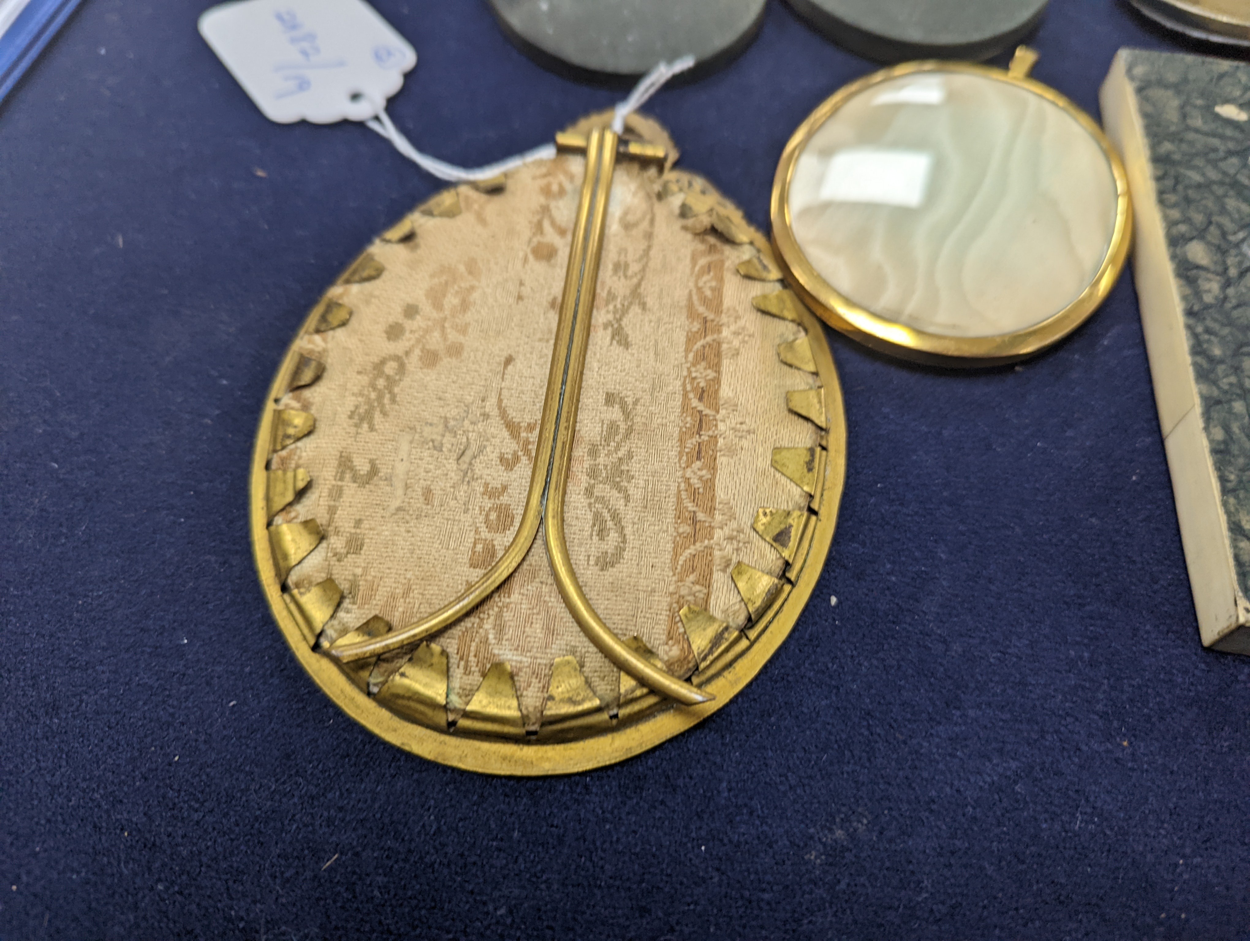 A paste and enamel framed Portrait miniature on ivory, 9.2cm and four other portrait miniatures (three on ivory)